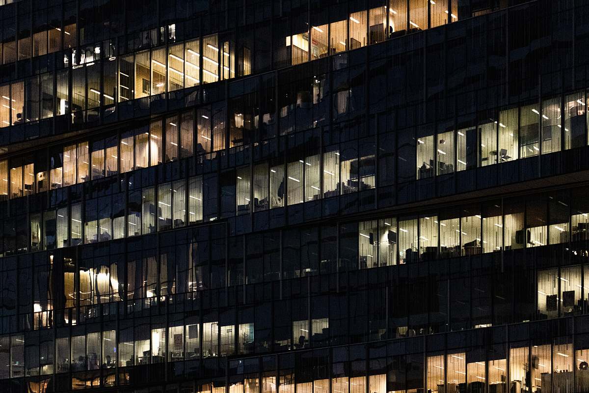 office building low angle photo of curtain glass wall building town